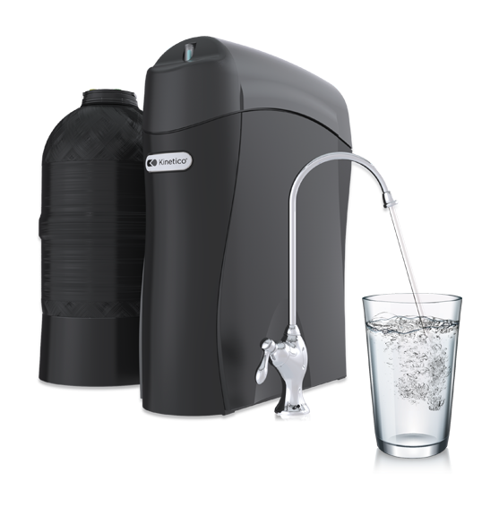 Kinetico K5 Drinking Water Station with its own kitchen faucet, storage tank and a filled glass