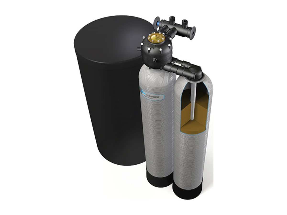 Cutaway of a Kinetico softener beside its brine tank