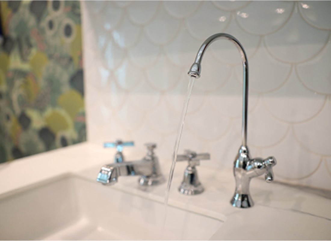 A K5 drinking water faucet beside the main kitchen tap