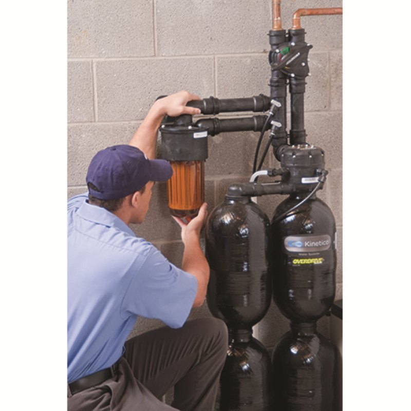 A Cardinal technician servicing a Kinetico softener
