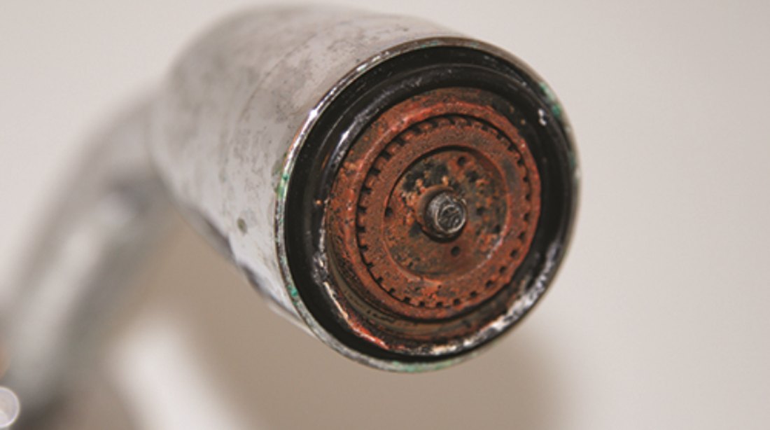 Iron and rust buildup crusted on a household fixture