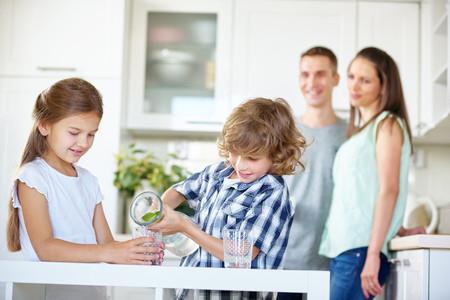 Pouring clean drinking water from a dedicated Kinetico faucet