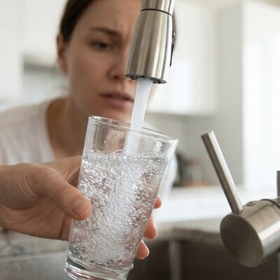 Glass of water with unpleasant taste